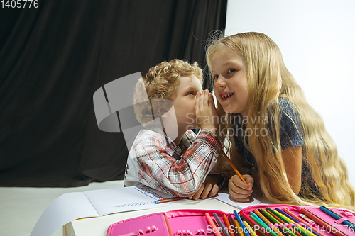 Image of Boy and girl preparing for school after a long summer break. Back to school.