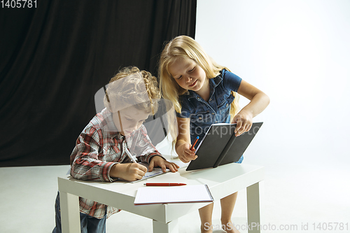 Image of Boy and girl preparing for school after a long summer break. Back to school.