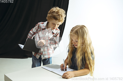 Image of Boy and girl preparing for school after a long summer break. Back to school.