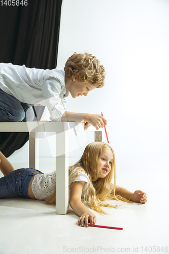 Image of Boy and girl preparing for school after a long summer break. Back to school.