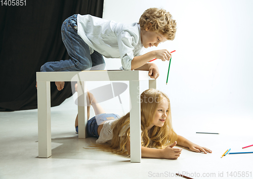 Image of Boy and girl preparing for school after a long summer break. Back to school.