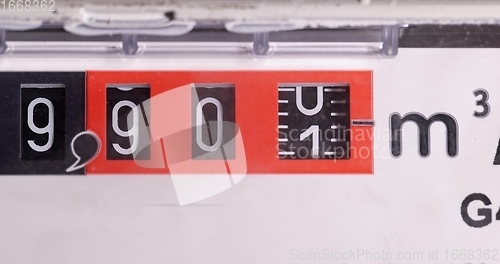 Image of Gas counter closeup footage with numbers spinning
