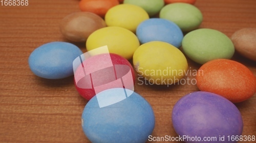 Image of Colorful chocolate confectionery in camera motion