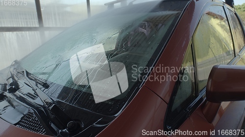 Image of Eashing dirty car closeup footage