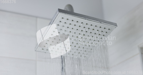 Image of Water flowing from shower head 120 fps slow motion closeup footage