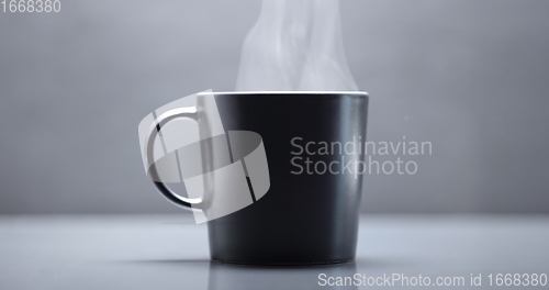 Image of Vapor rising from hot mug closeup footage