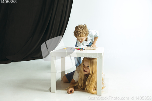 Image of Boy and girl preparing for school after a long summer break. Back to school.