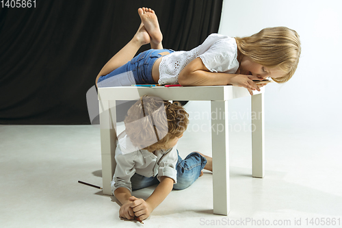 Image of Boy and girl preparing for school after a long summer break. Back to school.