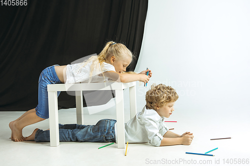 Image of Boy and girl preparing for school after a long summer break. Back to school.