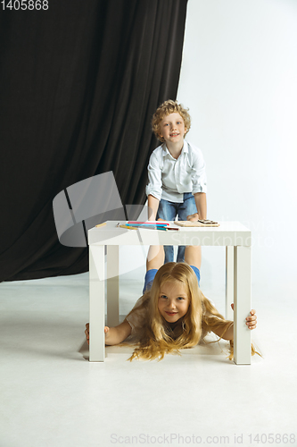 Image of Boy and girl preparing for school after a long summer break. Back to school.