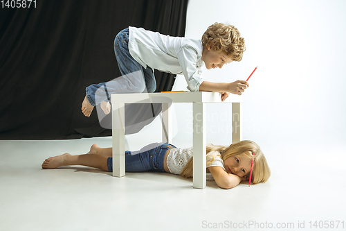 Image of Boy and girl preparing for school after a long summer break. Back to school.