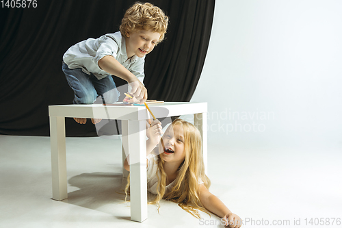 Image of Boy and girl preparing for school after a long summer break. Back to school.