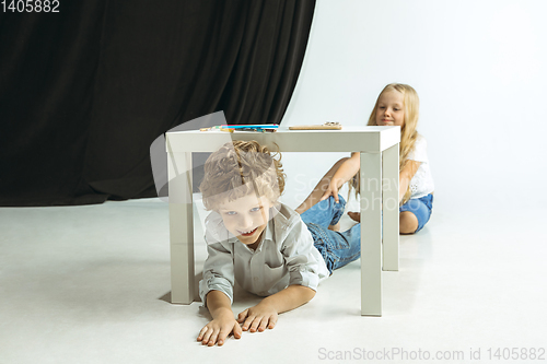 Image of Boy and girl preparing for school after a long summer break. Back to school.