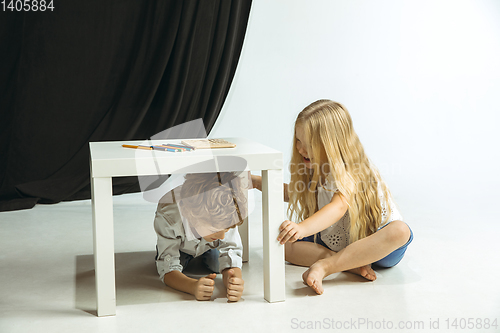 Image of Boy and girl preparing for school after a long summer break. Back to school.