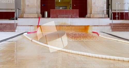 Image of Empty pool with thermal water flowing through