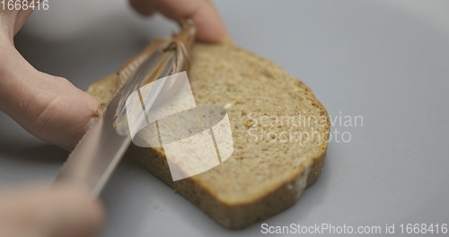 Image of Chocolate spread on whole grain bread slow motion 120fps footage