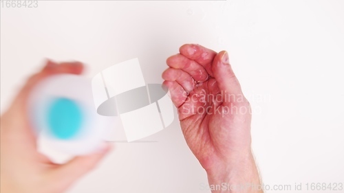 Image of Washing hands with fluid disinfectant closeup footage