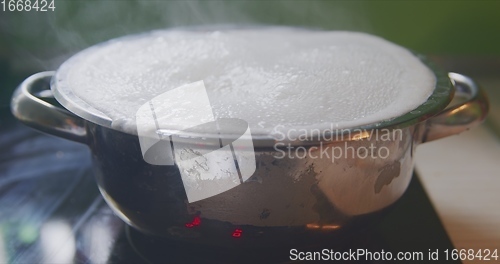 Image of Steam or vapor clouds rising from boiling water