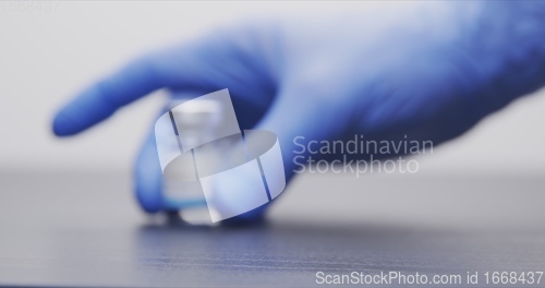 Image of Vaccine in human hands closeup footage