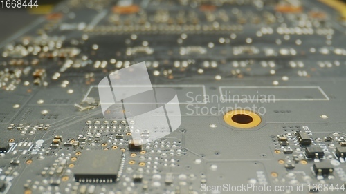 Image of Probe lens pushing into circuit board macro footage