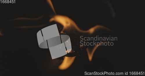 Image of Amulet burning in the fire 120fps slow motion footage