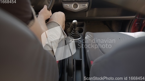 Image of Switching gearshift while driving car