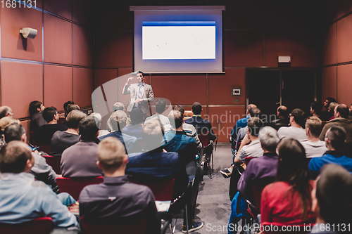 Image of Speaker Giving a Talk at Business Meeting.