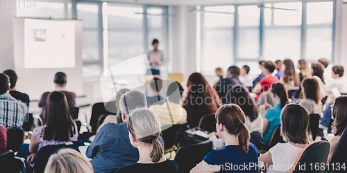 Image of Speaker giving presentation on business conference.