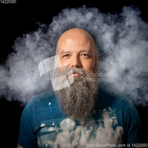 Image of bearded man smoke portrait