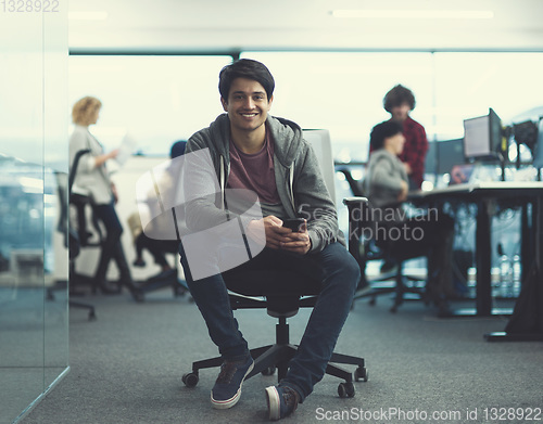 Image of software developer using mobile phone