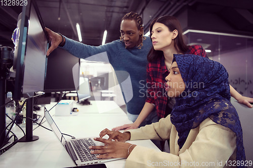 Image of multiethnics team of software developers working together