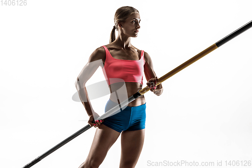 Image of Female pole vaulter training on white studio background