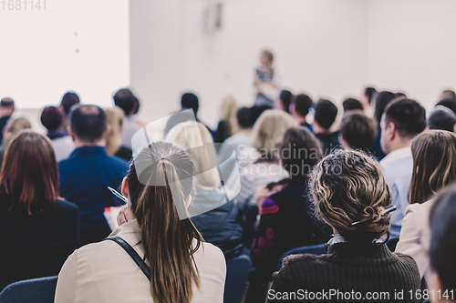 Image of Woman giving presentation on business conference.