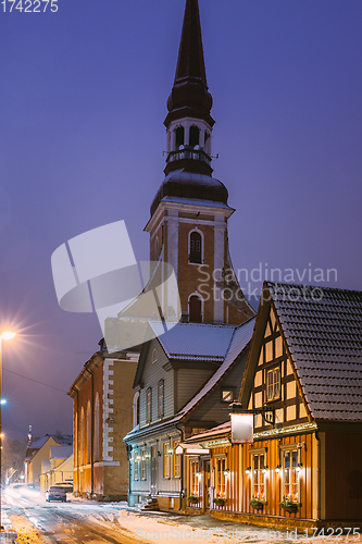 Image of Parnu, Estonia. Night View Of Kuninga Street With Old Houses, Restaurants, Cafe, Hotels And Shops In Evening Night Illuminations. View Of Lutheran Church Of St. Elizabeth On Background