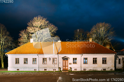 Image of Kuressaare, Saaremaa Island, Estonia. Museum Old House Building Near Episcopal Castle In Evening Blue Hour Night. Traditional Medieval Architecture, Famous Attraction Landmark