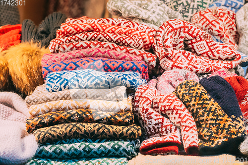 Image of Various Colorful Knitted Traditional European Warm Clothes - Scarfs At Winter Christmas Market. Winter Souvenir