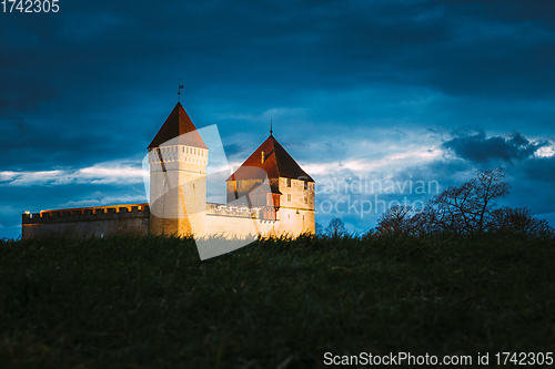 Image of Kuressaare, Saaremaa Island, Estonia. Episcopal Castle In Evening Blue Hour Night. Traditional Medieval Architecture, Famous Attraction Landmark. Old Tower.