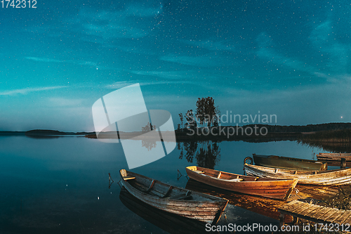 Image of Real Starry Sky And Night Stars Above Lake. Natural Starry Sky Reflection Landscape .