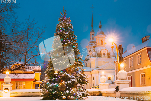 Image of Parnu, Estonia. Christmas Tree In Holiday New Year Festive Illumination And St. Katherine Orthodox Church On Background