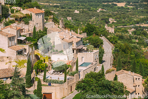 Image of Gordes, Provence, France. Beautiful Scenic View Of Medieval Hilltop Village Of Gordes. Sunny Summer Sky. Famous Landmark.