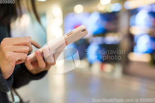 Image of Woman sending text message on smart phone