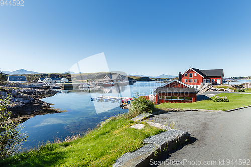 Image of view on norwegian fjord with houses along coastline