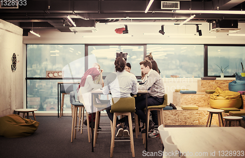 Image of Young Multiethnic Business team using virtual reality headset