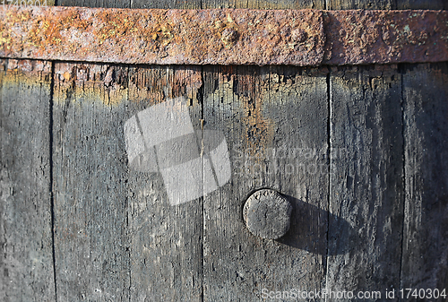 Image of Texture of very old barrel for wine with a cork and a rusty meta