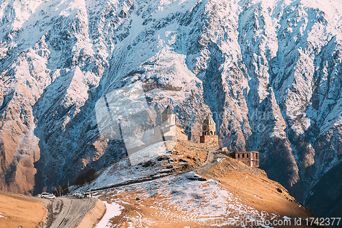 Image of Stepantsminda, Gergeti, Georgia. Iconic Famous Gergeti Trinity Tsminda Sameba Church In Early Winter Landscape. Beautiful Georgian Mountains Landscape