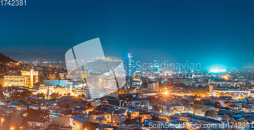 Image of Tbilisi, Georgia. Elevated Rooftop View In Night Illuminations. Georgian Capital Skyline Cityscape. Panorama, Panoramic Evening View