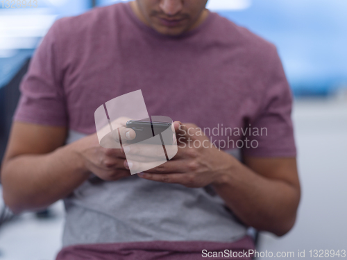 Image of software developer using mobile phone