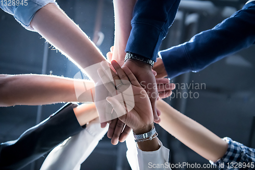 Image of multiethnic Group of young business people celebrating success