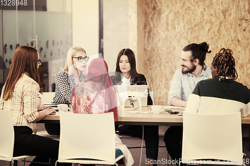 Image of multiethnic business team learning about drone technology