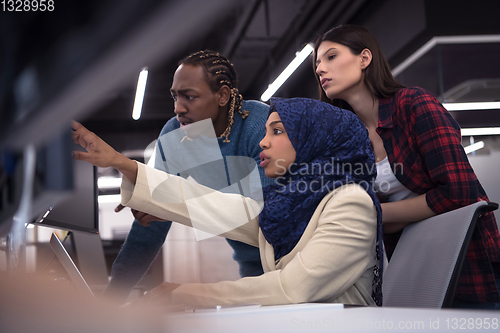 Image of multiethnics team of software developers working together